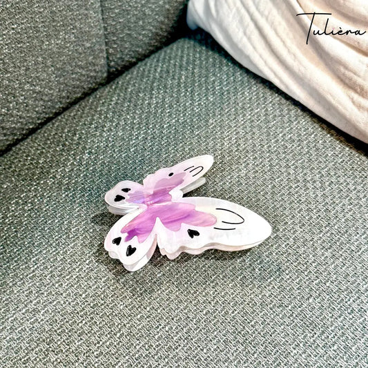 Fehér-lila színű pillangó alakú hajcsat