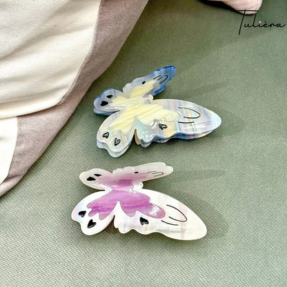 Fehér-lila színű pillangó alakú hajcsat